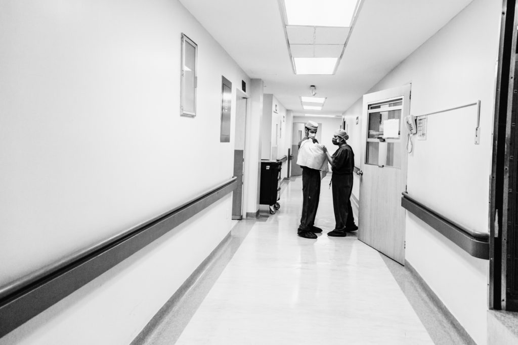 A man and neewly father holding his newly born baby walks through a hospital aisle to meet the mother, the 12 of May of 2020, in the City of Queretaro, Mexico. During times of Covid-19.
